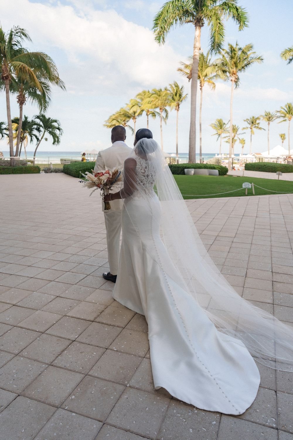 Bride walking outdoor aisle